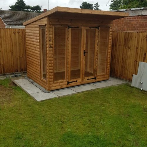 Garden Room in corner of back garden on patio pad